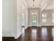 Bright foyer featuring dark hardwood floors, white trim, and a modern pendant light at 112 Dallas Mark Drive, Canton, GA 30115