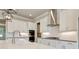Modern kitchen featuring white cabinets, stainless steel appliances, and stylish tile backsplash at 112 Dallas Mark Drive, Canton, GA 30115