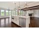 Spacious open kitchen with a center island, stainless appliances, hardwood floors and an eat in nook at 112 Dallas Mark Drive, Canton, GA 30115