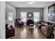 Bright living room with hardwood floors, stylish furniture, and plenty of natural light at 142 Parkway Dr, Fairburn, GA 30213