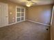 Bedroom with carpeted floors, a ceiling fan and a sliding door closet at 190 Applejack Dr, Douglasville, GA 30134