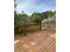 Enjoy picturesque views of the surrounding trees from this spacious wooden back deck at 190 Applejack Dr, Douglasville, GA 30134