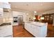 Well-lit kitchen with modern stainless steel appliances, a center island, and hardwood floors at 229 Peachtree Hills Ave # 124, Atlanta, GA 30305