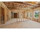 Unfinished basement with framed walls, windows, and open space for customization at 385 Riverwood Pass, Dallas, GA 30157