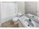 Clean bathroom with a combined tub and shower and a vanity at 405 Willow Shoals Dr, Covington, GA 30016