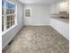 Bright kitchen area with lots of natural light, door to back and view to yard at 405 Willow Shoals Dr, Covington, GA 30016