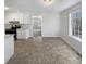 Bright kitchen area featuring white cabinets and stainless steel appliances at 405 Willow Shoals Dr, Covington, GA 30016