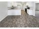 This kitchen is a great space, plenty of cabinets, stove and a door to the living area at 405 Willow Shoals Dr, Covington, GA 30016