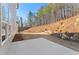 Backyard featuring a newly seeded lawn and a concrete patio at 731 Crest Line W Trl, Powder Springs, GA 30127