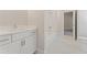 Bright bathroom featuring a single vanity and tub/shower combo, with a window for natural light at 731 Crest Line W Trl, Powder Springs, GA 30127