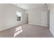 Large bedroom with natural light, neutral carpet, and a nearby ensuite bathroom at 731 Crest Line W Trl, Powder Springs, GA 30127