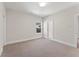 A bright bedroom with neutral walls, carpeted floors, and a window with natural light at 731 Crest Line W Trl, Powder Springs, GA 30127
