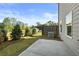 The backyard has a small concrete patio, gray fence, and mature landscaping at 228 Epping Street # 8, Stockbridge, GA 30281