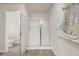This is a bathroom featuring a glass enclosed shower, tile floors, and a white toilet at 228 Epping Street # 8, Stockbridge, GA 30281