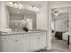 This is a bathroom with granite counters, double sinks, and neutral decor at 228 Epping Street # 8, Stockbridge, GA 30281