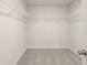 This is an empty closet featuring wire shelving and neutral colored carpet at 228 Epping Street # 8, Stockbridge, GA 30281