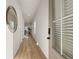 Light and airy hallway featuring wood floors and modern decor creates a welcoming entrance at 228 Epping Street # 8, Stockbridge, GA 30281