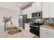 Well-equipped kitchen with stainless steel appliances, granite countertops, and white cabinetry offers both style and functionality at 228 Epping Street # 8, Stockbridge, GA 30281