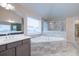 Bathroom showcasing double sinks, a soaking tub, and a glass-enclosed shower at 6650 Canyon Cv, Cumming, GA 30028