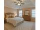Cozy bedroom features a comfortable bed, dresser, and natural light at 6650 Canyon Cv, Cumming, GA 30028