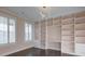 Bright office space featuring custom built-in bookshelves and drawers, perfect for a home library at 6650 Canyon Cv, Cumming, GA 30028