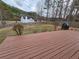 Large backyard with privacy fence, deck, and mature trees at 9620 Carolina Dr, Jonesboro, GA 30238