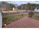Fenced backyard with mature trees view from the wood deck at 9620 Carolina Dr, Jonesboro, GA 30238