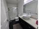 This bathroom has a shower with white subway tile and a modern sink at 9620 Carolina Dr, Jonesboro, GA 30238
