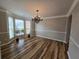 Elegant dining room with hardwood floors, chandelier, and bay window at 9620 Carolina Dr, Jonesboro, GA 30238