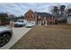 Charming two-story brick home with a two-car garage and well-maintained front yard at 9620 Carolina Dr, Jonesboro, GA 30238