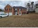 Charming brick home with well-maintained lawn, a two-car garage and classic curb appeal at 9620 Carolina Dr, Jonesboro, GA 30238