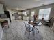 Bright kitchen with stainless steel appliances, white cabinets, and tile floors at 9620 Carolina Dr, Jonesboro, GA 30238