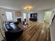 Comfortable living room with fireplace, hardwood floors, and natural light at 9620 Carolina Dr, Jonesboro, GA 30238