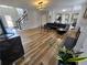 Beautiful living room with fireplace, hardwood floors, and open floor plan at 9620 Carolina Dr, Jonesboro, GA 30238
