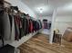 Spacious walk-in closet with ample hanging space and built-in shelving for organized storage at 9620 Carolina Dr, Jonesboro, GA 30238