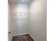 The closet features a wire shelf, carpet and a white door with a silver handle at 1102 Campbell Rd, Covington, GA 30014