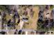 Property aerial with surrounding neighborhood and tree coverage at 4983 Arcado Sw Rd, Lilburn, GA 30047