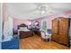 A bedroom featuring a large window, and light-colored walls at 4983 Arcado Sw Rd, Lilburn, GA 30047
