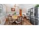 A dining room with a modern stainless steel refrigerator at 4983 Arcado Sw Rd, Lilburn, GA 30047