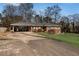 Charming brick home with a carport and well-manicured front yard at 4983 Arcado Sw Rd, Lilburn, GA 30047