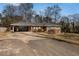 Charming brick home with a carport and well-manicured front yard at 4983 Arcado Sw Rd, Lilburn, GA 30047