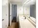 Bright bathroom with a large mirror, vanity, and sink at 5926 Brassie Ridge Ln, Ellenwood, GA 30294