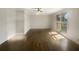 Spacious bedroom with hardwood floors, ceiling fan, and window views at 5926 Brassie Ridge Ln, Ellenwood, GA 30294