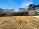 Charming brick ranch home with a covered porch and well-maintained lawn under a blue sky at 5926 Brassie Ridge Ln, Ellenwood, GA 30294