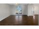 Bright living room featuring hardwood floors and large windows for lots of natural sunlight at 5926 Brassie Ridge Ln, Ellenwood, GA 30294