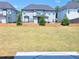Beautifully landscaped backyard with a well-maintained lawn at 2634 Mourning Dove Drive (Lot 41), Grayson, GA 30017