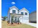 Beautiful two-story home with white siding, dark shutters, and a well-manicured lawn at 2634 Mourning Dove Drive (Lot 41), Grayson, GA 30017