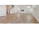 Spacious living room with an electric fireplace, wood-look floors, and plenty of natural light at 2634 Mourning Dove Drive (Lot 41), Grayson, GA 30017