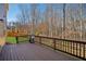 Enjoy outdoor living on this wooden deck with a grill and backyard view at 3610 Ansley Manor Ct, Cumming, GA 30028