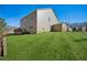 Expansive backyard features lush grass, a deck, and a wooden fence at 3610 Ansley Manor Ct, Cumming, GA 30028